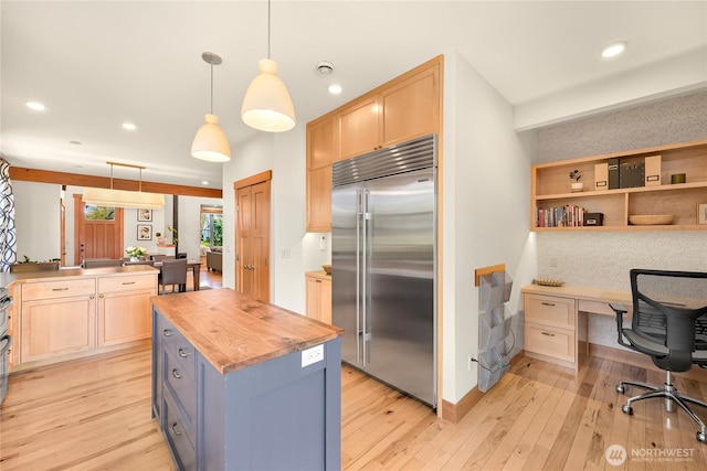 2518 S Park Dr, Bellingham, WA 98225 - kitchen with stainless steel built in refrigerator, butcher block countertops, light wood finished floors, light brown cabinets, and decorative light fixtures