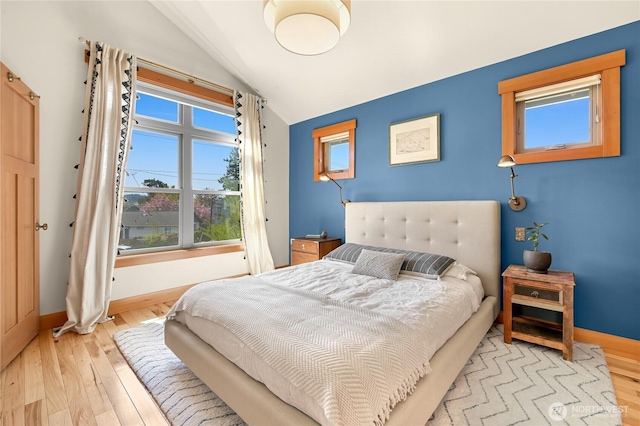 2518 S Park Dr, Bellingham, WA 98225 - bedroom with vaulted ceiling, baseboards, and hardwood / wood-style floors
