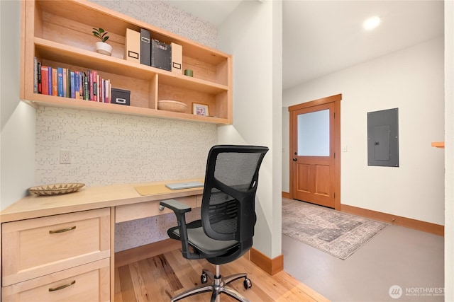 2518 S Park Dr, Bellingham, WA 98225 - office space featuring electric panel, built in desk, baseboards, and light wood-style floors