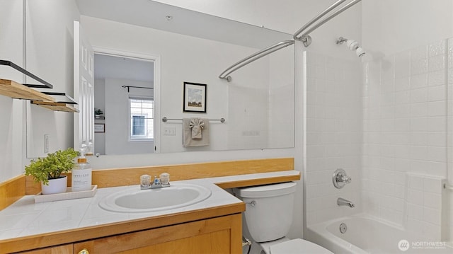 bathroom with toilet, vanity, and shower / bath combination