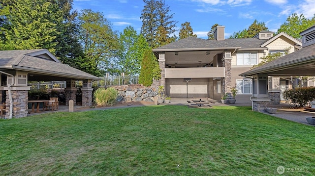 view of green lawn with a patio area and a gazebo