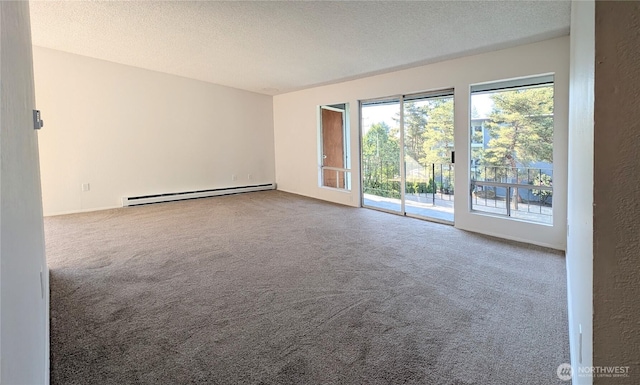 10459 Des Moinesmemorial Dr S Unit N-301, Seattle, WA 98168 - carpeted empty room featuring a baseboard radiator and a textured ceiling