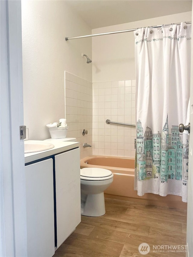 10459 Des Moinesmemorial Dr S Unit N-301, Seattle, WA 98168 - full bathroom featuring shower / bath combo, vanity, toilet, and wood finished floors