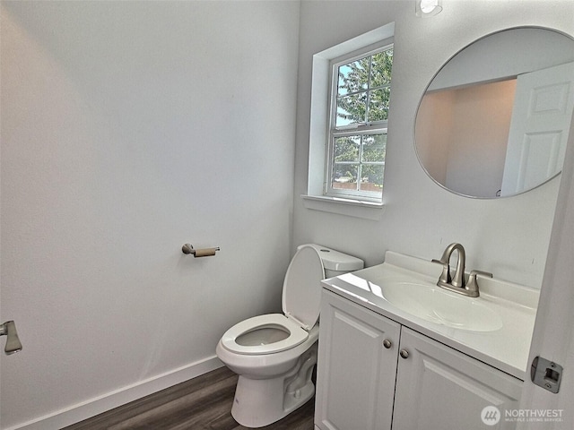 408-410 E 4th St, Warden, WA 98857 - bathroom with toilet, wood finished floors, vanity, and baseboards