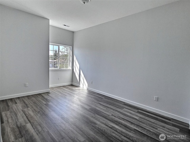408-410 E 4th St, Warden, WA 98857 - empty room with dark wood finished floors and baseboards