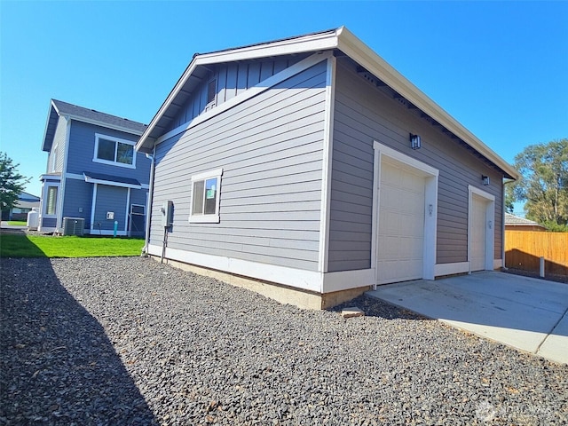 408-410 E 4th St, Warden, WA 98857 - view of home's exterior with fence, concrete driveway, and cooling unit