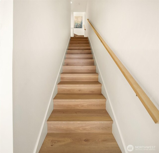 stairs with wood finished floors