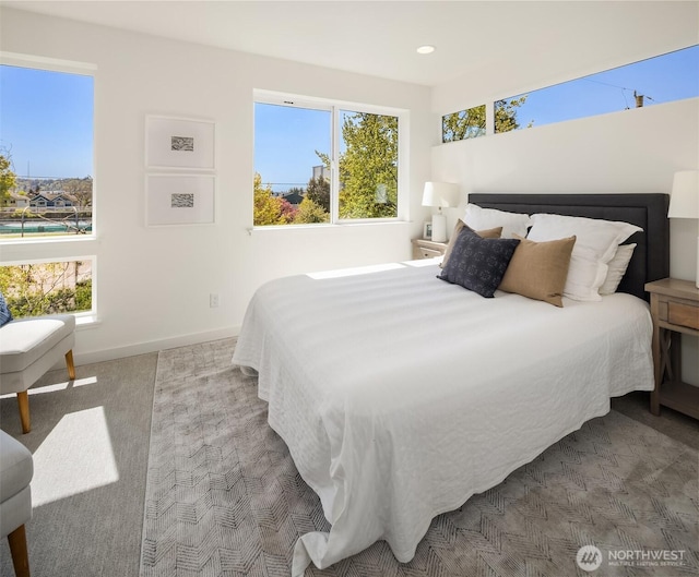 carpeted bedroom with baseboards and recessed lighting