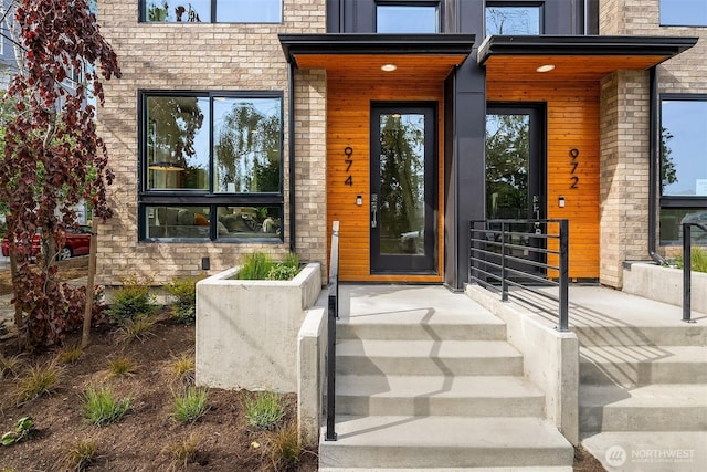 entrance to property with stone siding