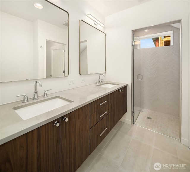 full bath with a shower stall, double vanity, tile patterned floors, and recessed lighting