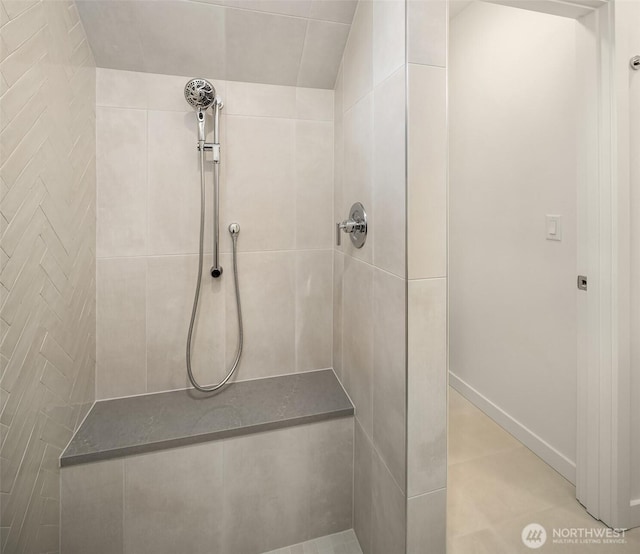 full bath with a tile shower