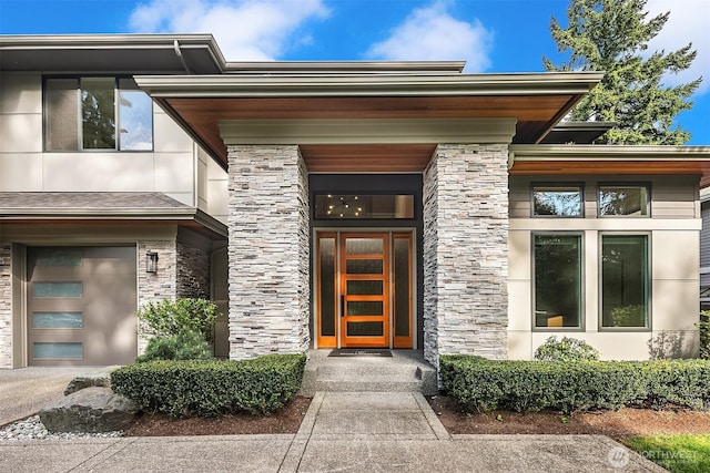 property entrance with stone siding and stucco siding