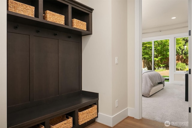 mudroom with baseboards, light wood-type flooring, and recessed lighting
