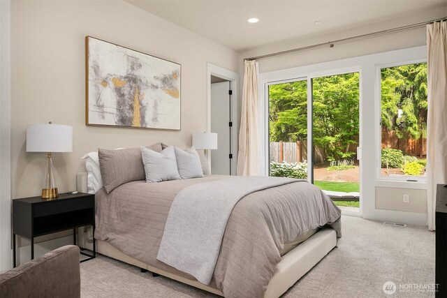 bedroom featuring access to exterior, light carpet, and recessed lighting