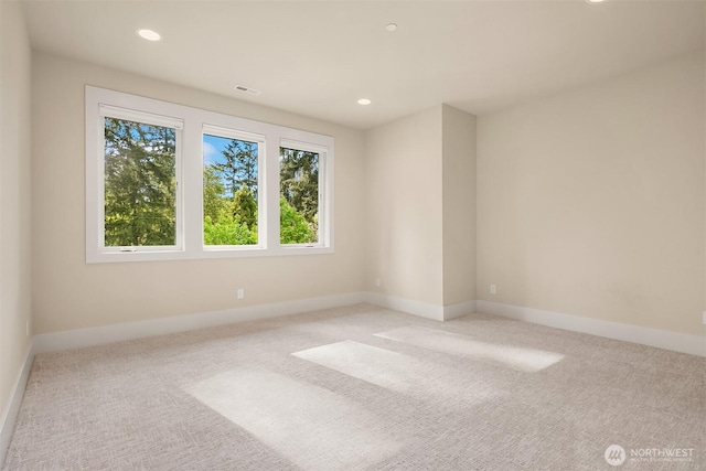 unfurnished room with carpet flooring, baseboards, and recessed lighting