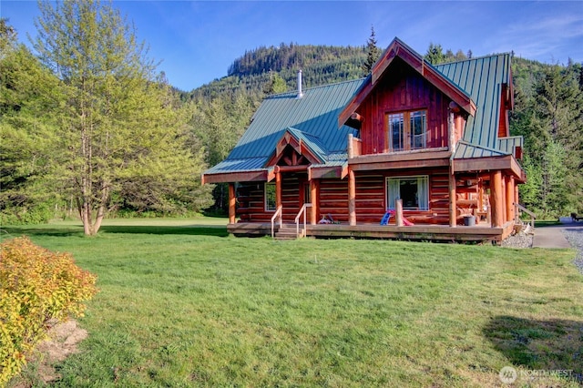 53932 Rockport Cascade Rd, Rockport, WA 98283 - log home featuring a front lawn, metal roof, a view of trees, and a deck