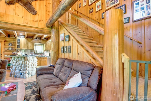 53932 Rockport Cascade Rd, Rockport, WA 98283 - living room with wood walls, stairs, wood finished floors, and beamed ceiling