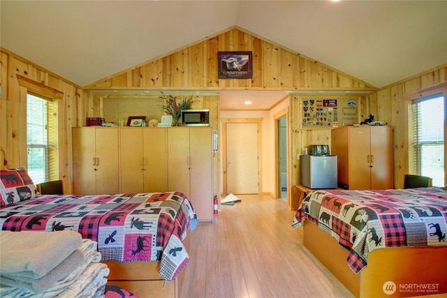 53932 Rockport Cascade Rd, Rockport, WA 98283 - bedroom featuring vaulted ceiling, wood walls, and light wood finished floors