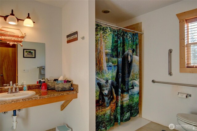 53932 Rockport Cascade Rd, Rockport, WA 98283 - bathroom featuring a sink, curtained shower, toilet, and tile patterned flooring