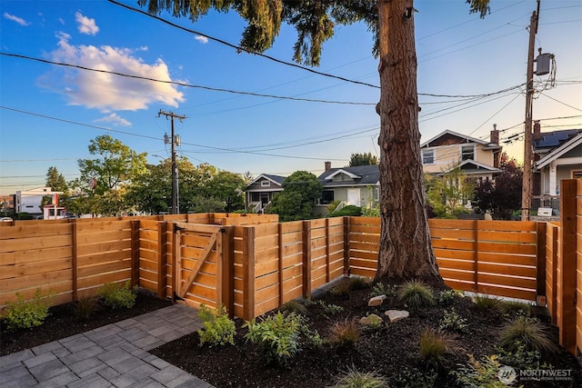 view of yard with fence and a gate