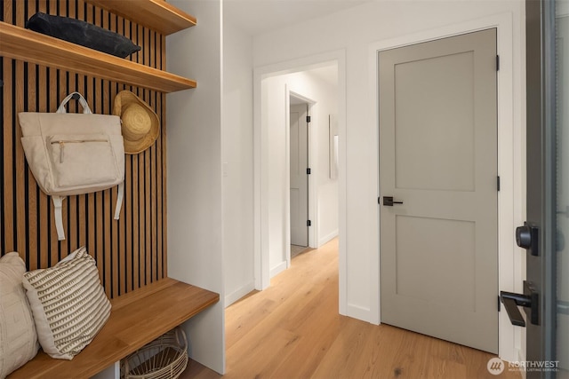 mudroom with light wood-style flooring and baseboards