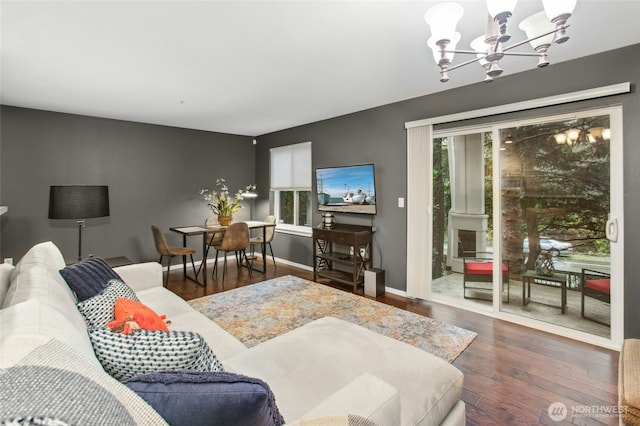 5589 Lakemont Blvd SE Unit 1702, Bellevue, WA 98006 - bedroom with multiple windows, a chandelier, wood finished floors, and access to exterior