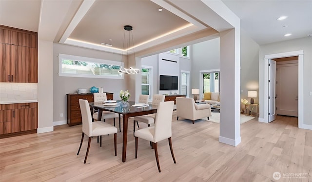 1593 213th Ct NE, Sammamish, WA 98074 - dining room featuring light wood-style flooring, a raised ceiling, recessed lighting, and a chandelier