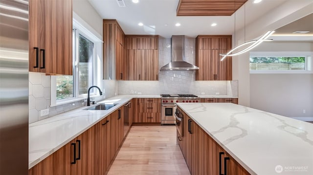1593 213th Ct NE, Sammamish, WA 98074 - kitchen featuring wall chimney exhaust hood, stainless steel appliances, modern cabinets, light stone countertops, and recessed lighting