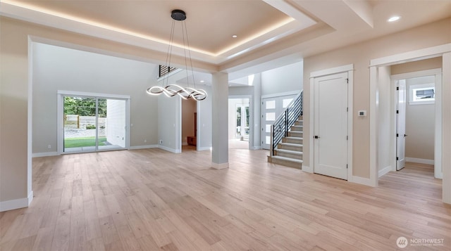 1593 213th Ct NE, Sammamish, WA 98074 - unfurnished dining area featuring plenty of natural light, a raised ceiling, light wood-style floors, stairs, and recessed lighting