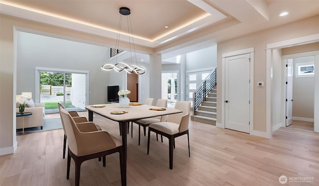 1593 213th Ct NE, Sammamish, WA 98074 - dining area with light wood-style flooring, a raised ceiling, stairs, and recessed lighting