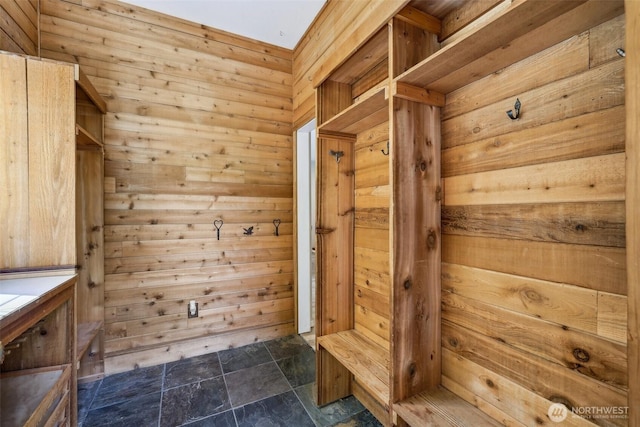 mudroom with stone finish floors and a sauna