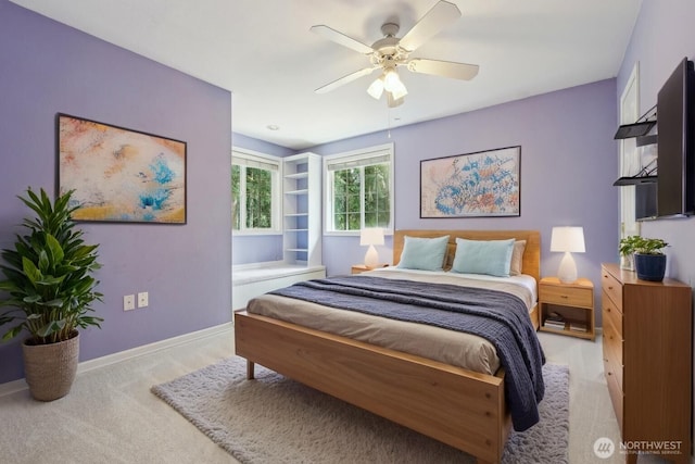 bedroom with ceiling fan and baseboards