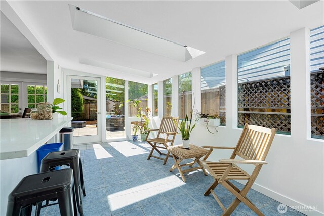 sunroom featuring tile patterned floors
