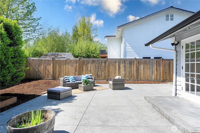 view of patio / terrace featuring an outdoor hangout area and a fenced backyard