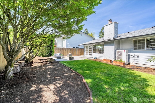 back of property with a patio and a chimney