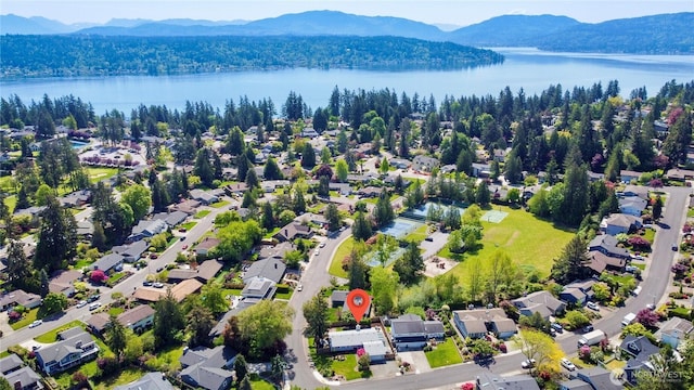 view of property location with a water and mountain view