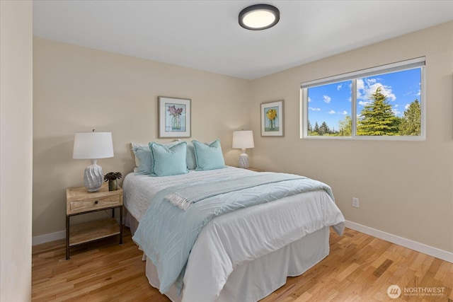 7344 125th Pl SE, Newcastle, WA 98056 - bedroom featuring baseboards and light wood-type flooring