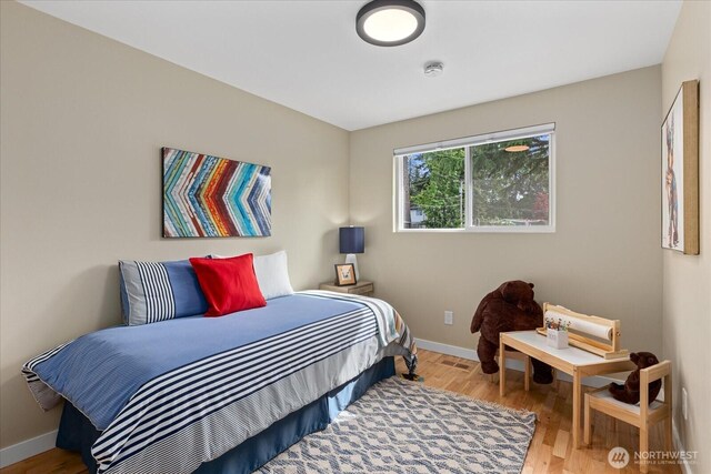 7344 125th Pl SE, Newcastle, WA 98056 - bedroom featuring baseboards and wood finished floors
