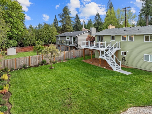7344 125th Pl SE, Newcastle, WA 98056 - back of property with stairs, a wooden deck, a storage shed, an outdoor structure, and a chimney