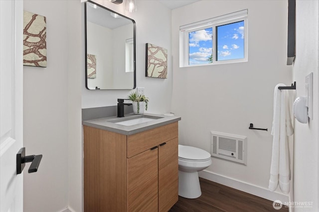 7344 125th Pl SE, Newcastle, WA 98056 - bathroom with toilet, wood finished floors, vanity, and baseboards