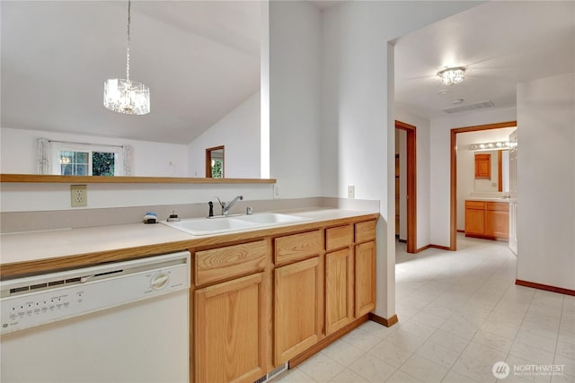 kitchen with dishwasher, a sink, a chandelier, light countertops, and baseboards