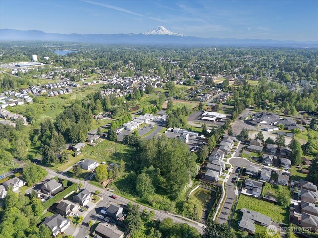 11511 SE 244th, Kent, WA 98030 - view of property location featuring nearby suburban area, a mountainous background, and a heavily wooded area