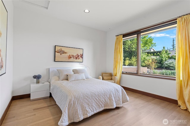8631 NE 19th Pl, Clyde Hill, WA 98004 - bedroom with baseboards, light wood-style flooring, and recessed lighting