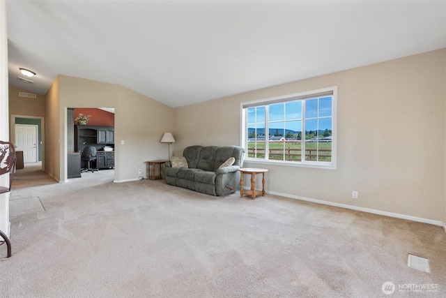 154 Mossyrock Rd W Unit 5, Mossyrock, WA 98564 - living area with lofted ceiling, carpet floors, baseboards, and a desk