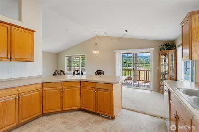 154 Mossyrock Rd W Unit 5, Mossyrock, WA 98564 - kitchen with a peninsula, lofted ceiling, healthy amount of natural light, and brown cabinetry