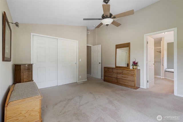 154 Mossyrock Rd W Unit 5, Mossyrock, WA 98564 - bedroom with a closet, vaulted ceiling, carpet flooring, baseboards, and connected bathroom
