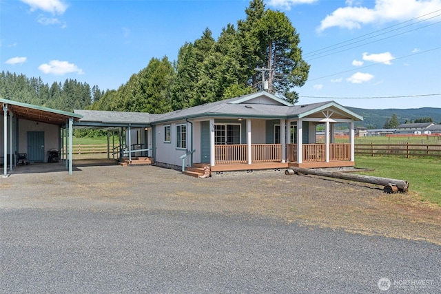 154 Mossyrock Rd W Unit 5, Mossyrock, WA 98564 - view of front of house featuring crawl space, covered porch, fence, and asphalt driveway