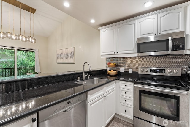 14651 NE 40th St Unit C4, Bellevue, WA 98007 - kitchen featuring appliances with stainless steel finishes, a sink, dark stone counters, tasteful backsplash, and white cabinets