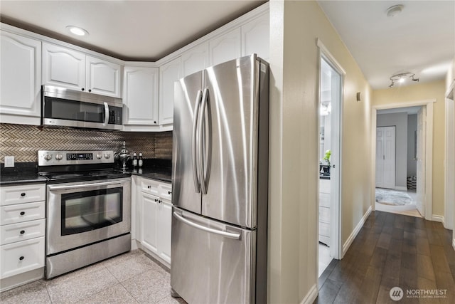 14651 NE 40th St Unit C4, Bellevue, WA 98007 - kitchen featuring stainless steel appliances, dark countertops, white cabinets, backsplash, and recessed lighting