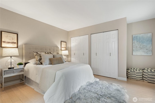14651 NE 40th St Unit C4, Bellevue, WA 98007 - bedroom featuring two closets and wood finished floors